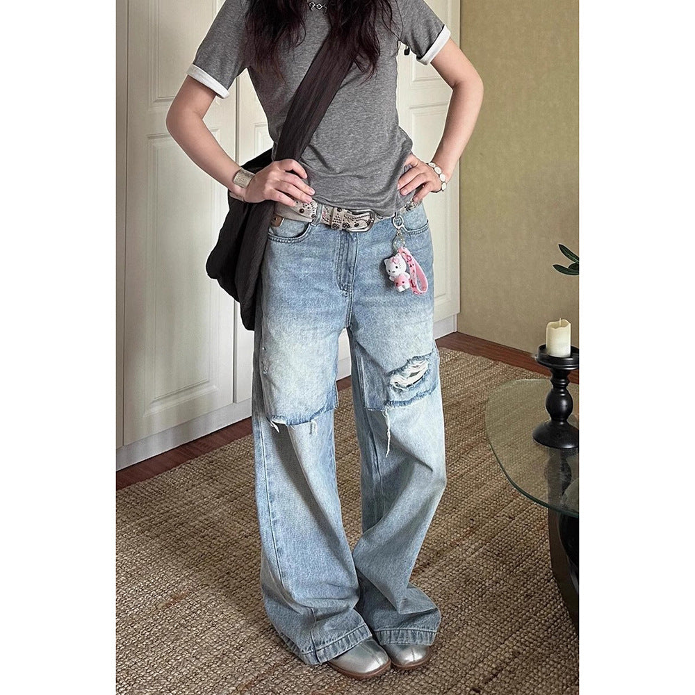 Jean déchiré long, délavé et usé au style vintage en petite série.