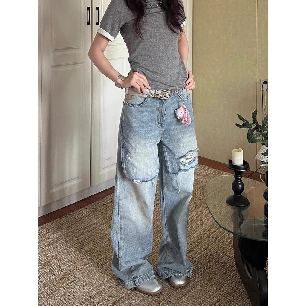 Jean déchiré long, délavé et usé au style vintage en petite série.