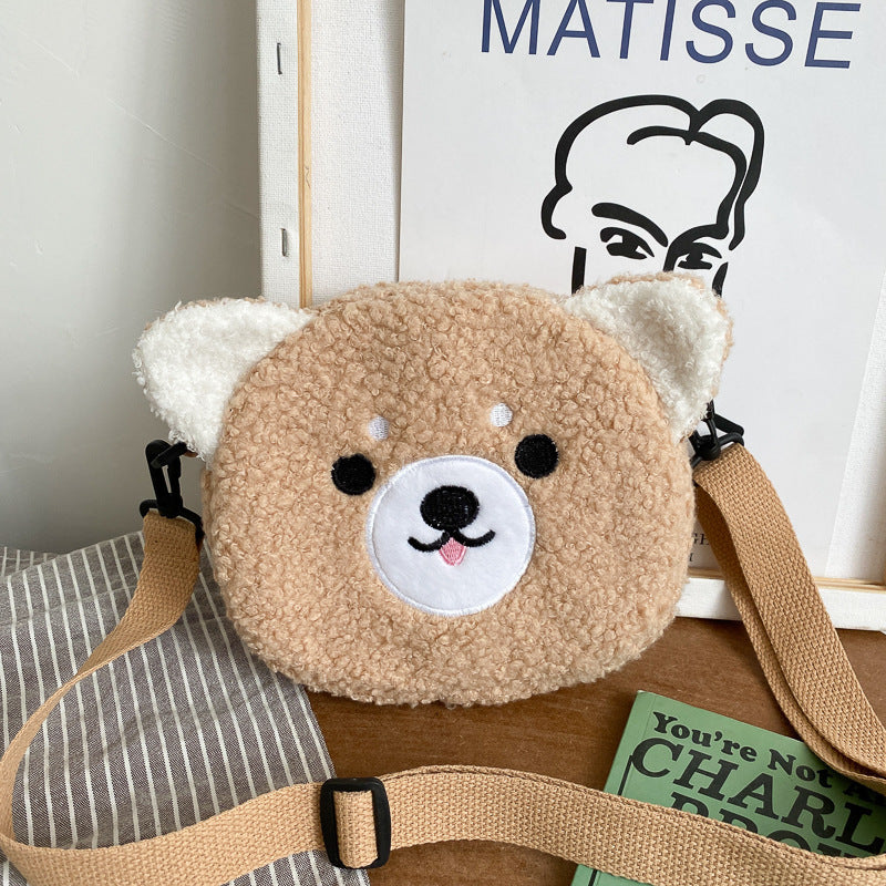 Petit sac rond en peluche mignon et élégant.