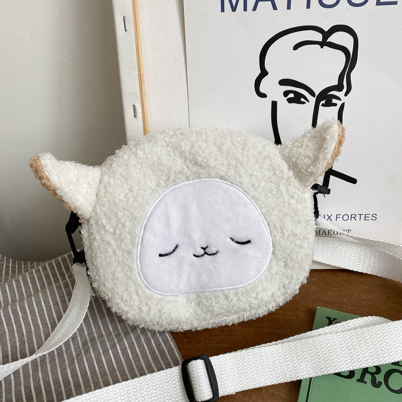 Petit sac rond en peluche mignon et élégant.