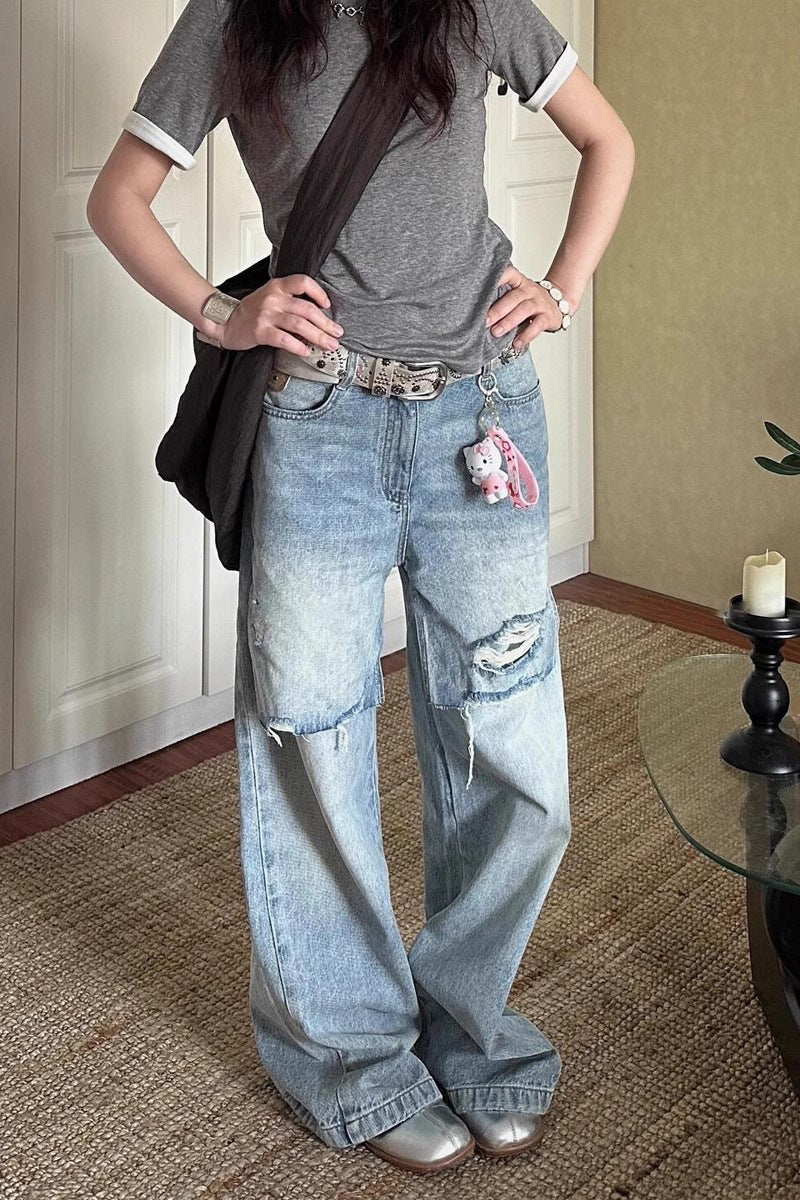 Jean déchiré long, délavé et usé au style vintage en petite série.