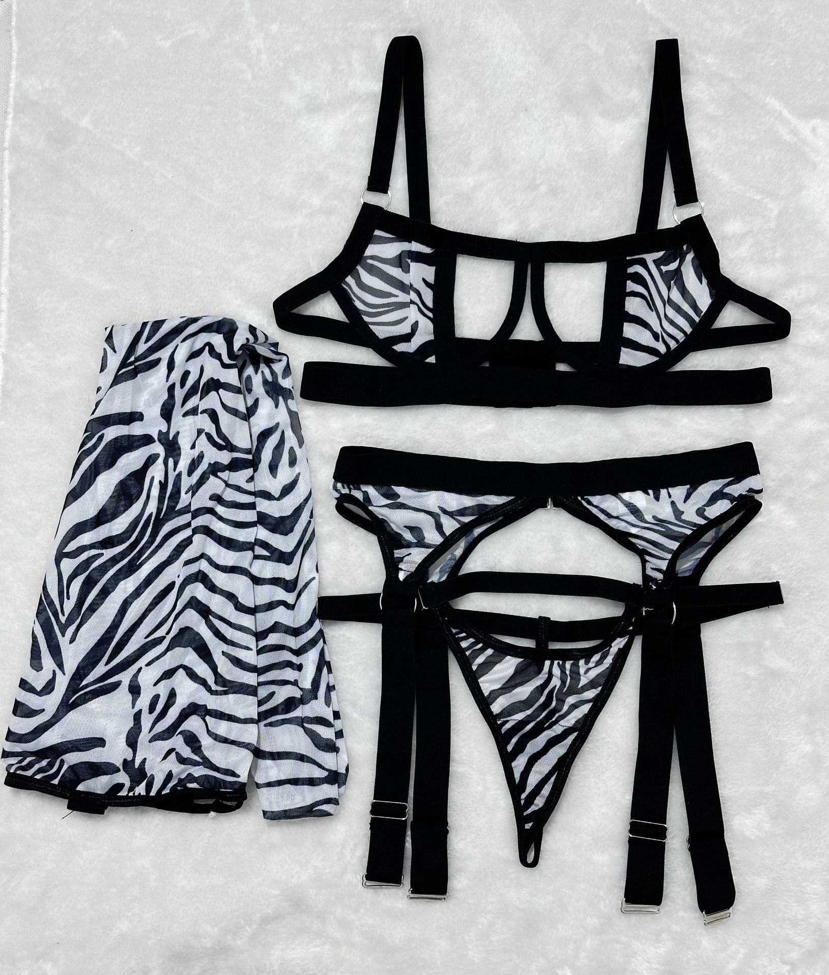 Ensemble de lingerie sexy quatre pièces en résille ajourée à imprimé léopard sauvage avec bas