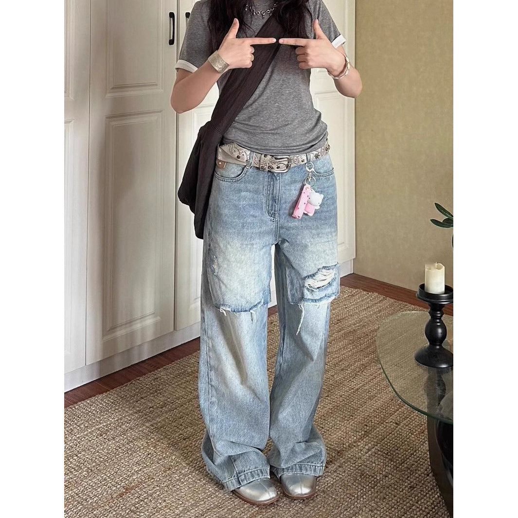 Jean déchiré long, délavé et usé au style vintage en petite série.