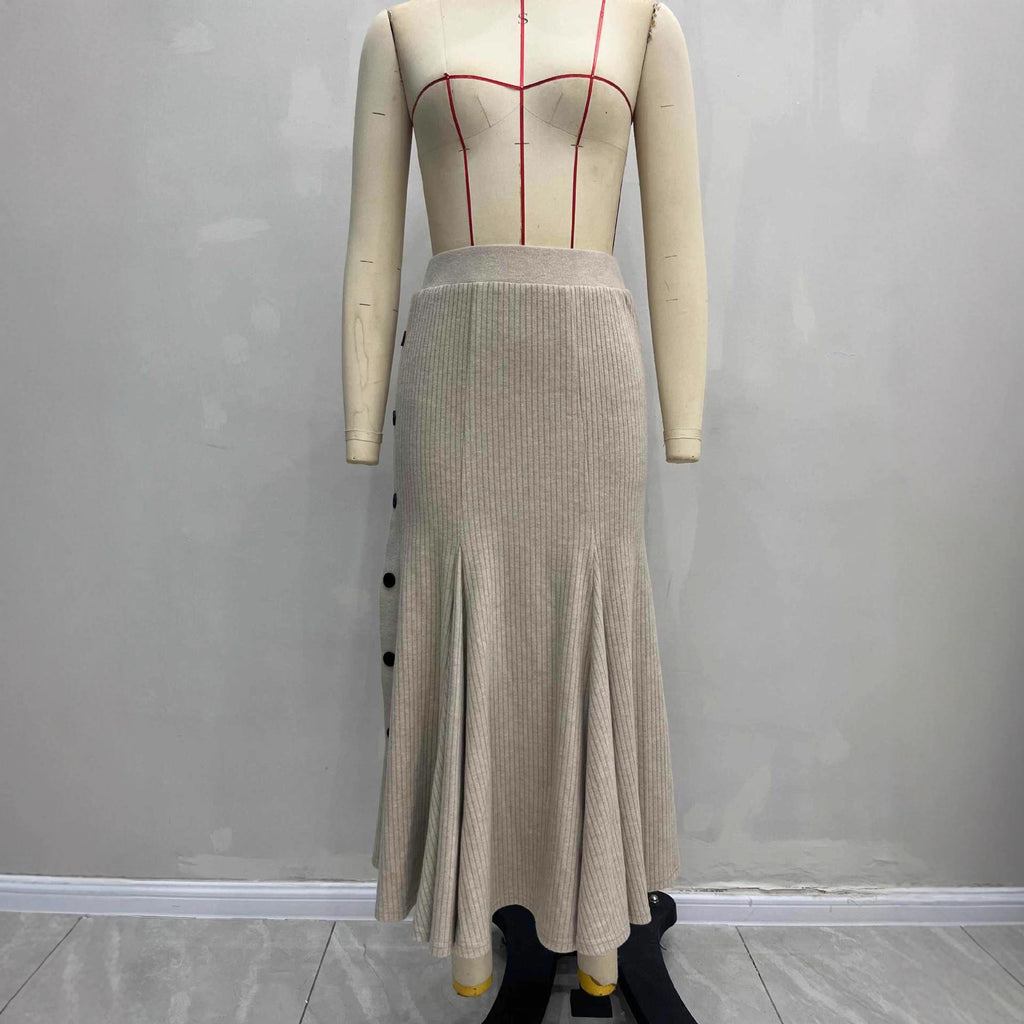 Jupe mi-longue en maille, taille haute, boutonnée sur le côté, coupe ajustée et fendue