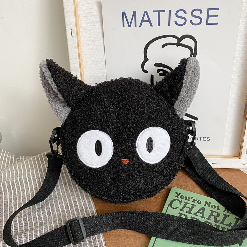 Petit sac rond en peluche mignon et élégant.