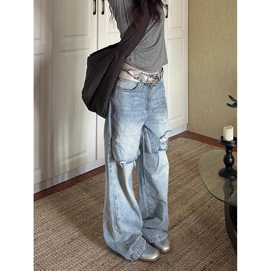 Jean déchiré long, délavé et usé au style vintage en petite série.